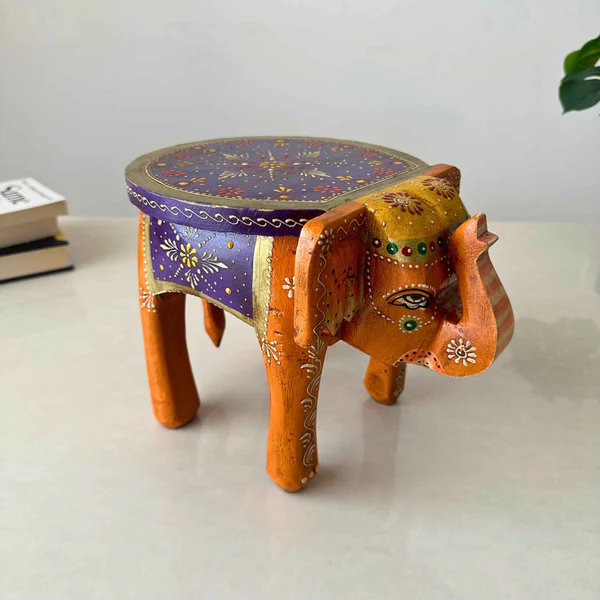 Atrangi_Studio_Wooden_Elephant_Stool_Orange_1_d978c82a-55e8-4d1a-8367-2d5e07a3f10c